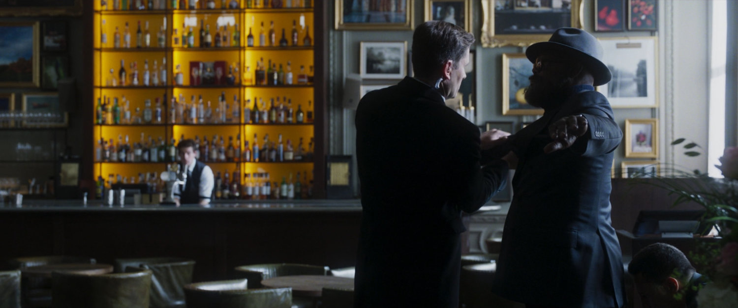Fury is frisked by Rhodes' security agent inside an empty Berners Tavern.