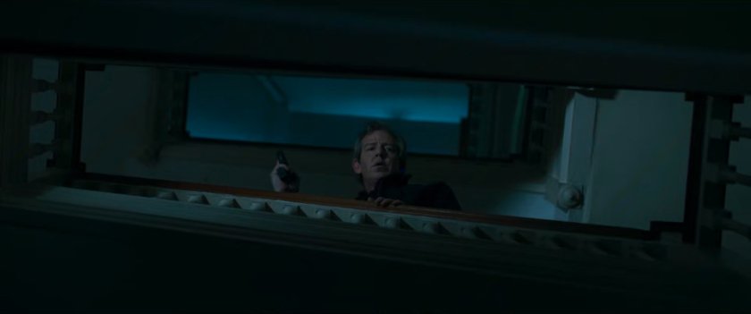 Talos looking over a stair railing.