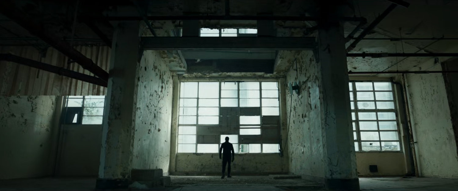 Interior of giant, dilapidated room in New Skrullos.