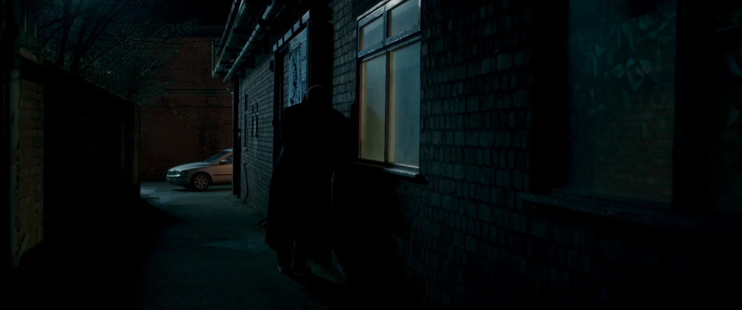 Nick Fury in a dark London alley.