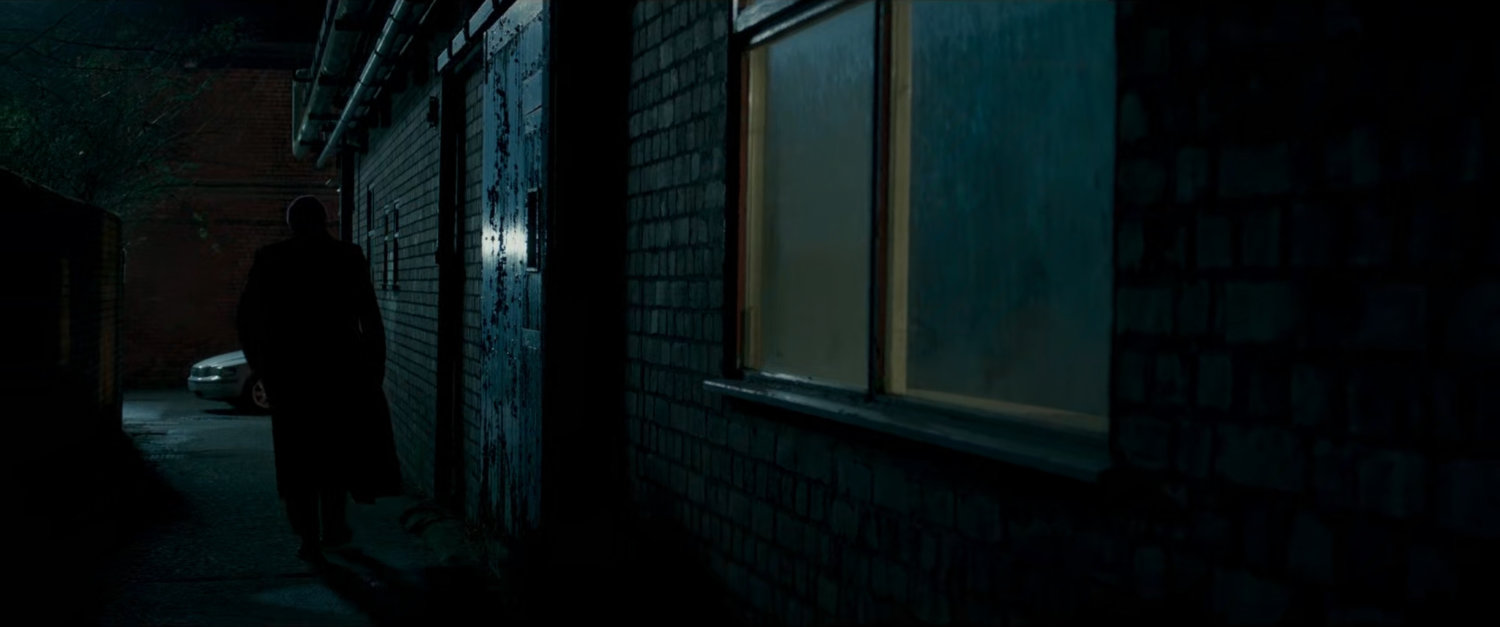 Nick Fury in a dark London alley.