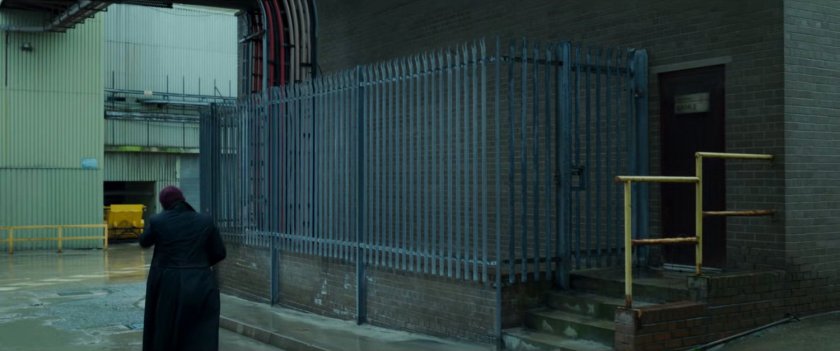 Nick Fury walking through an abandoned New Skrullos facility.