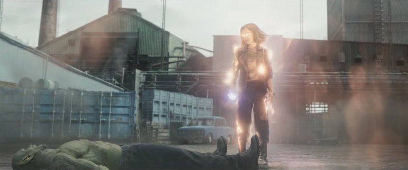 A glowing G'iah standing over a dead Gravik in the yard of New Skrullos.