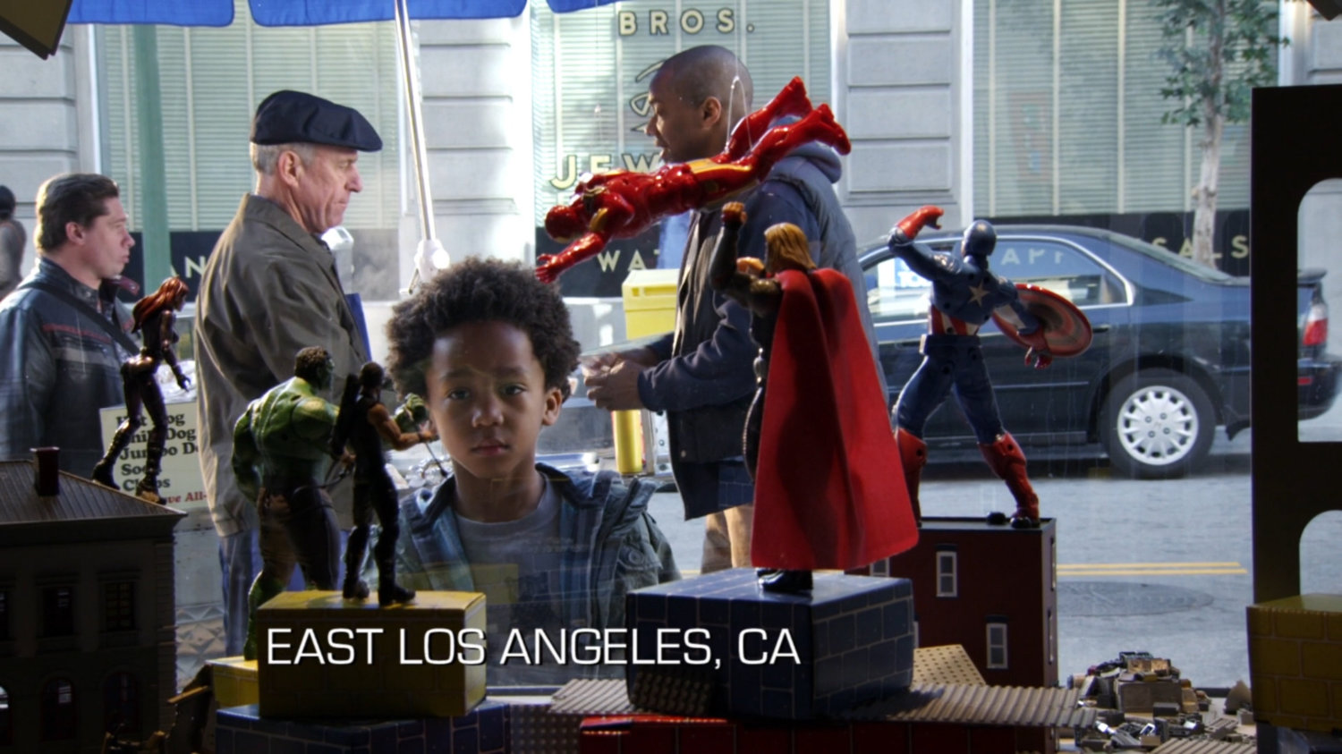 Mike Peterson and his son Ace outside a toy store. Text: East Los Angeles, CA.