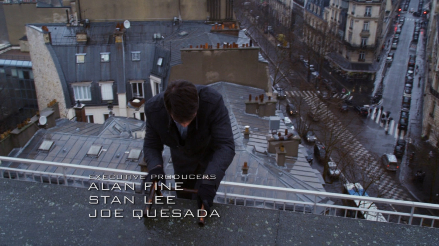 Grant Ward climbs over rooftop in Paris. Text: Executive Producers: Alan Fine, Stan Lee, Joe Quesada