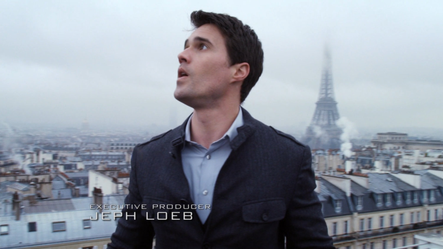Grant Ward on Paris rooftop with Eiffel Tower in background. Text: Executive Producer: Jeph Loeb.