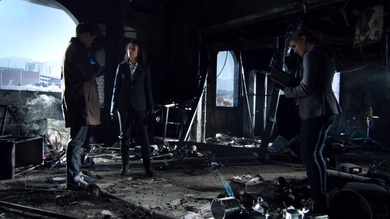 May, Fitz, and Simmons in a bombed out Centipede Lab.