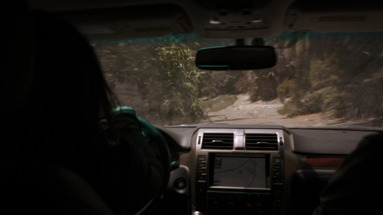 POV inside truck driving through Peruvian jungle.