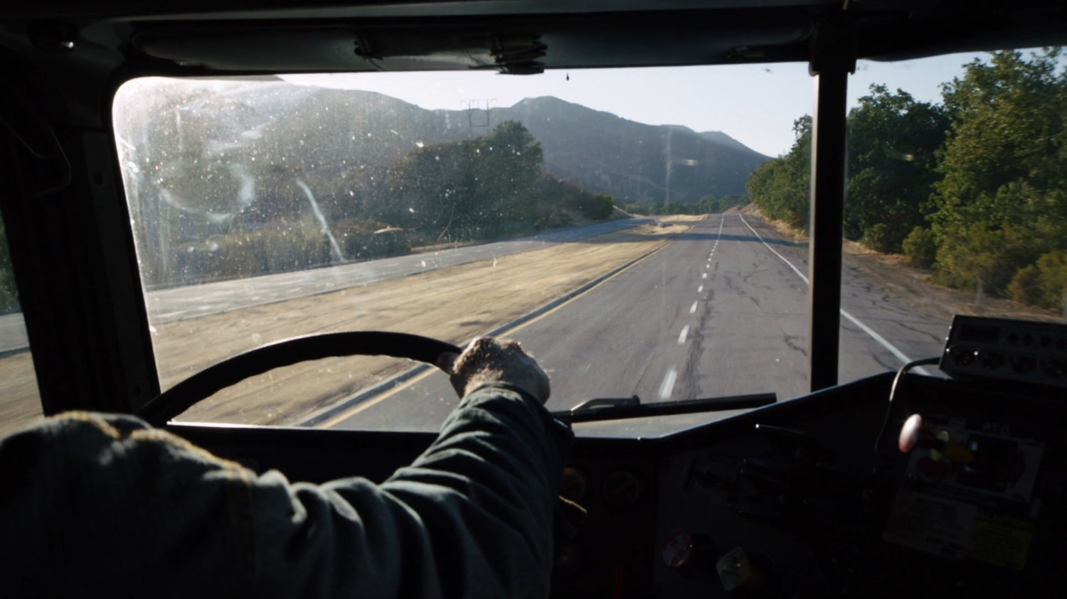 POV inside semi truck on Colorado highway.
