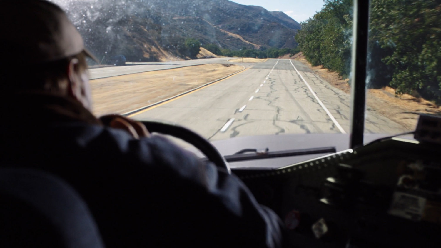POV inside semi truck on Colorado highway.