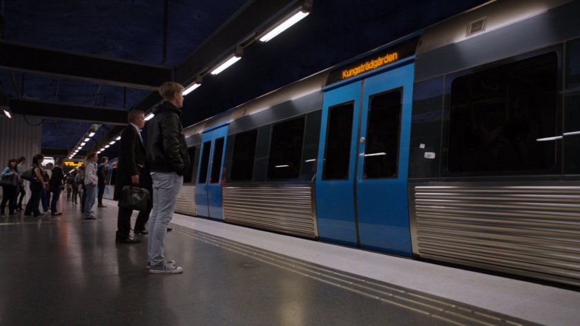 Passengers waiting for metro doors to open in T-Centralen subway in Stockholm, Sweden.