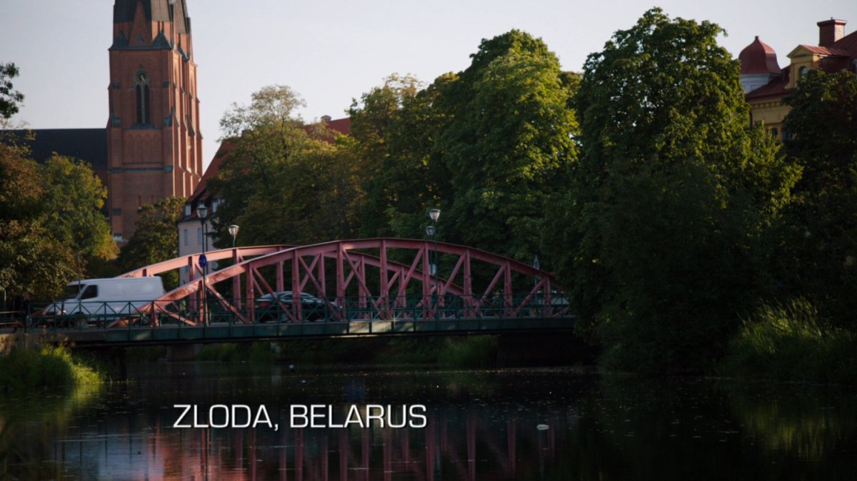 White van crossing a red bridge. Text: Zloda, Belarus.
