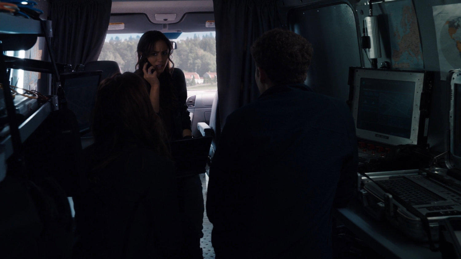 Skye and Fitz in a small van with Belarus countryside visible outside.