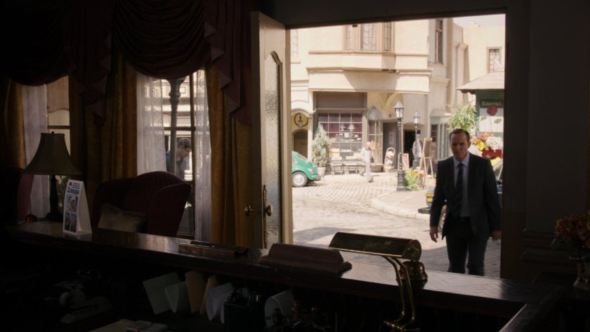 Coulson approaches a small hotel in Zloda town square.