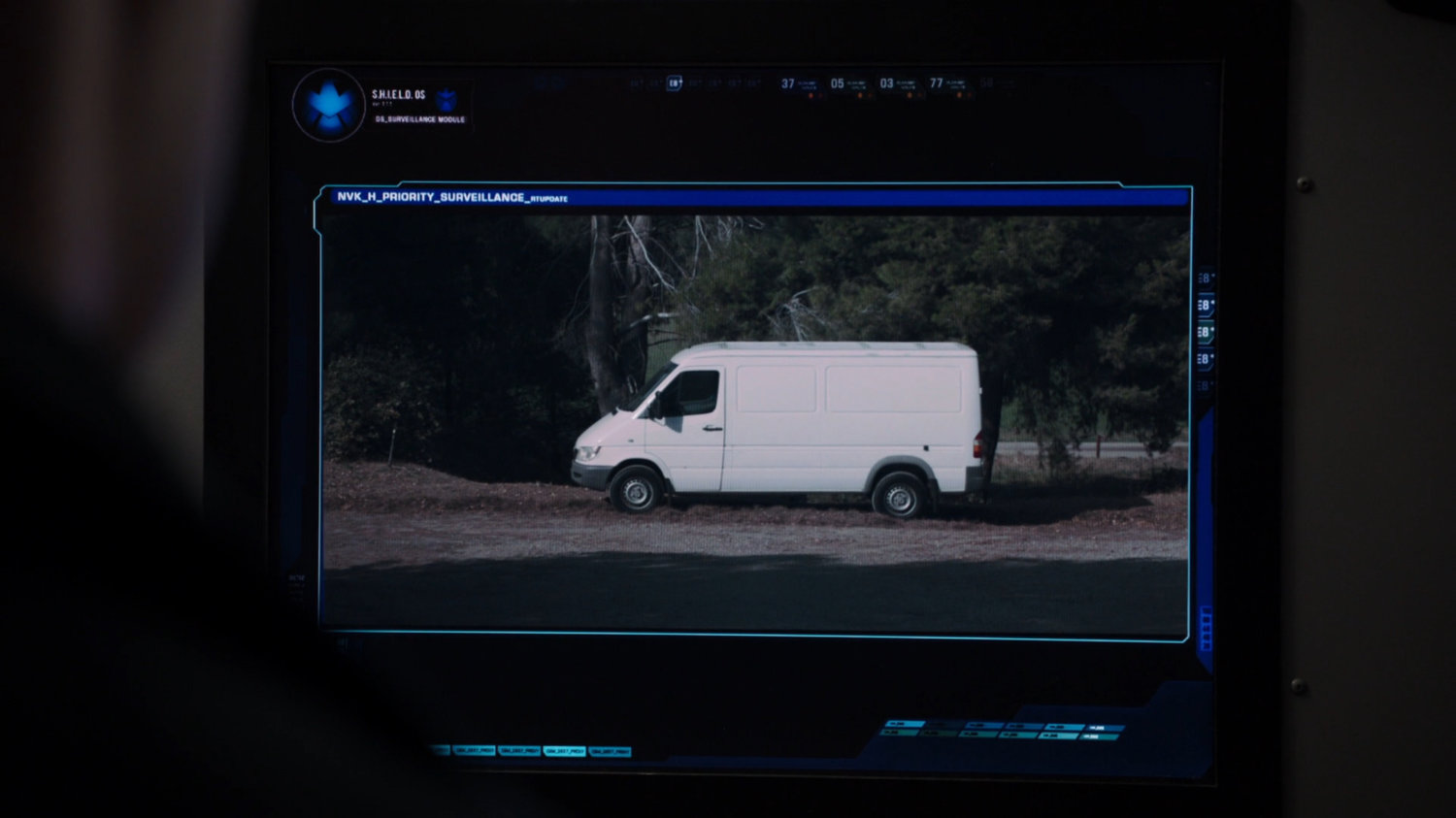 POV view of white van on computer monitor.