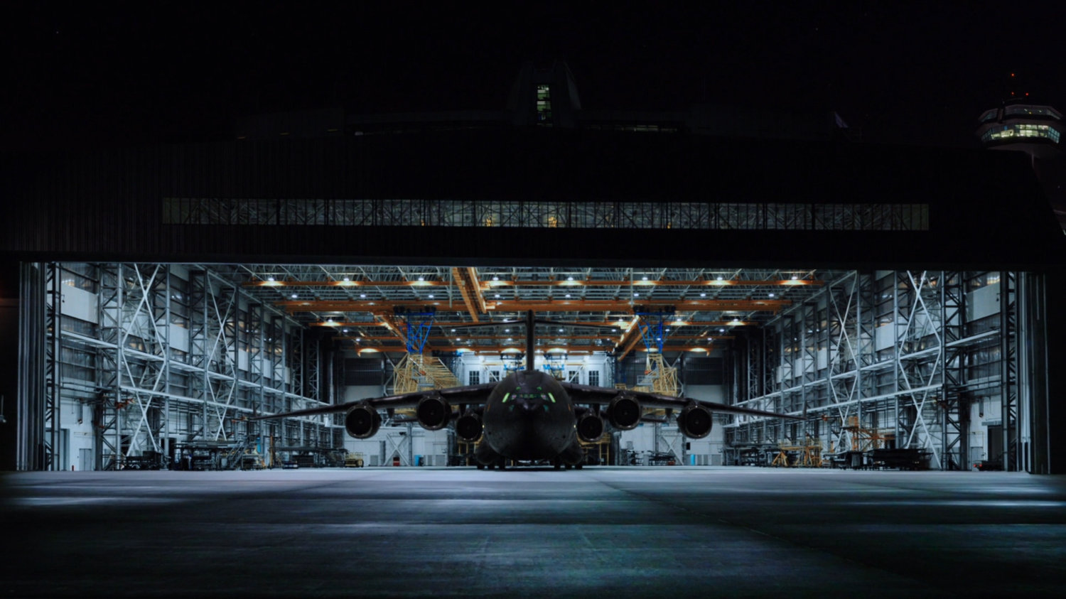 Nighttime shot of The Bus parked in a large Belarus hangar.