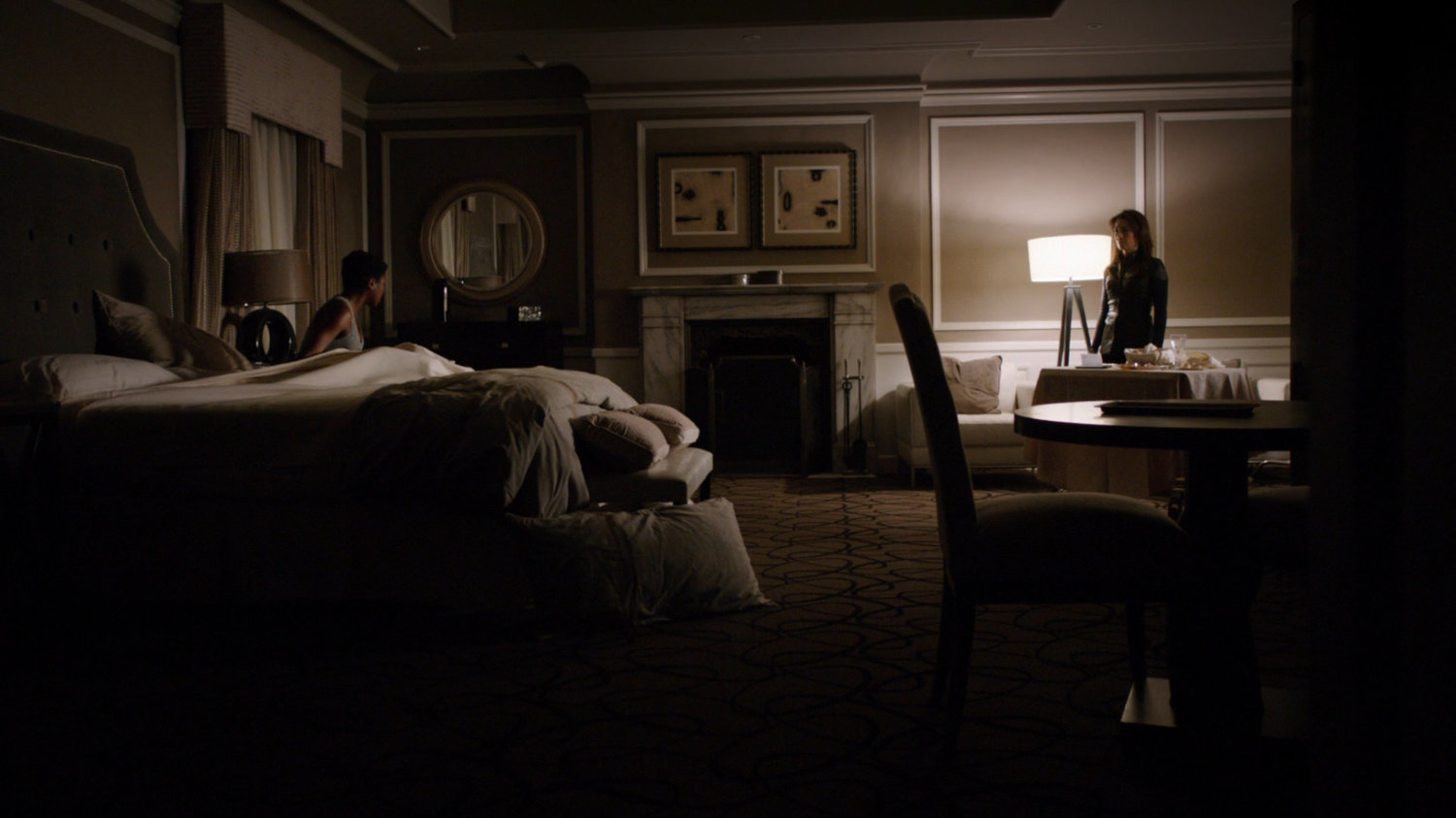 May confronts Agent Amador inside of Crown Regent Hotel room.