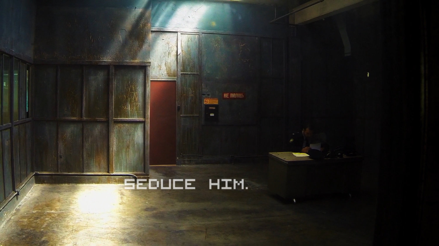 Interior of secured anteroom. Text: Seduce him.