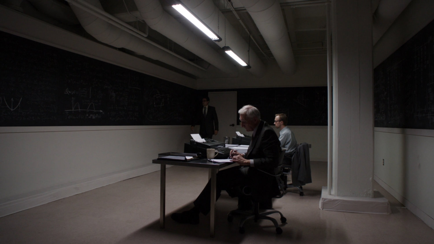 Interior work room with full chalkboards.