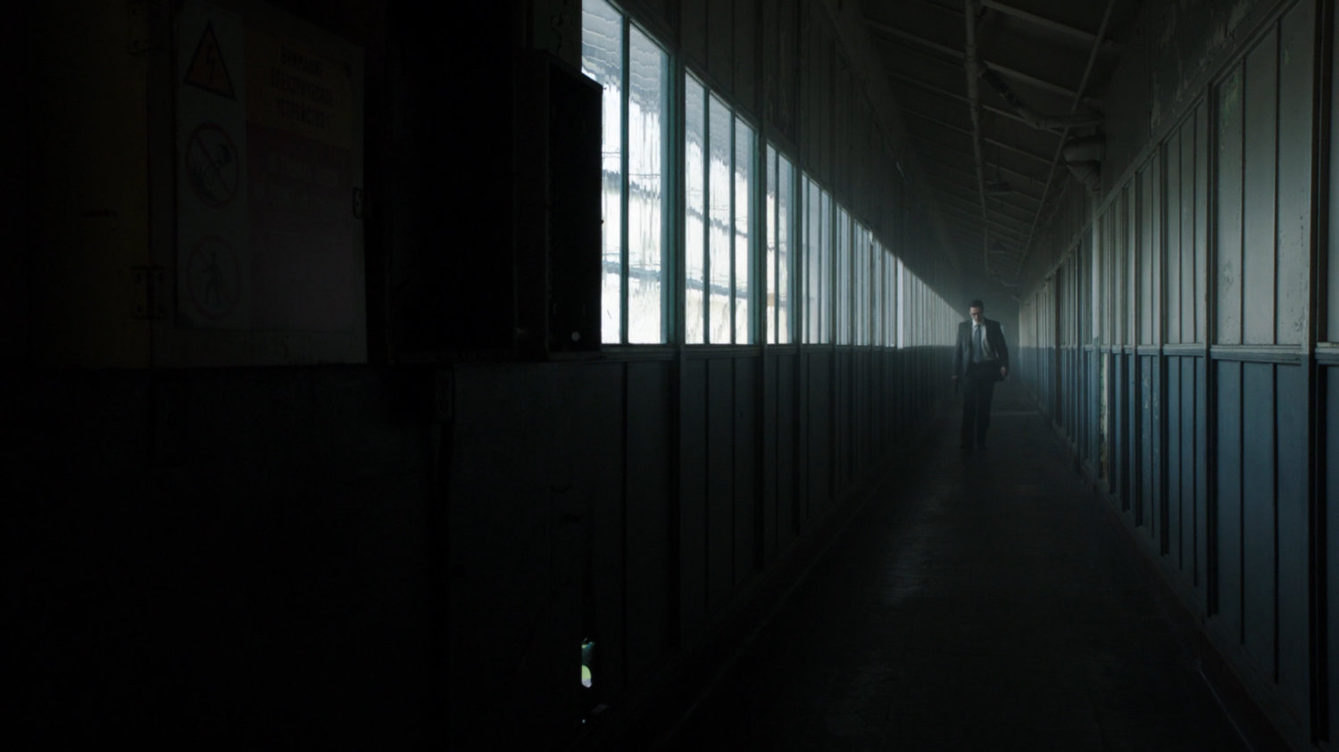 Ward in a long dark hallway of the Todorov Building.