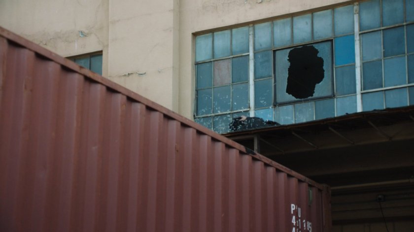 Ward crashing through window viewed from outside Todorov Building.