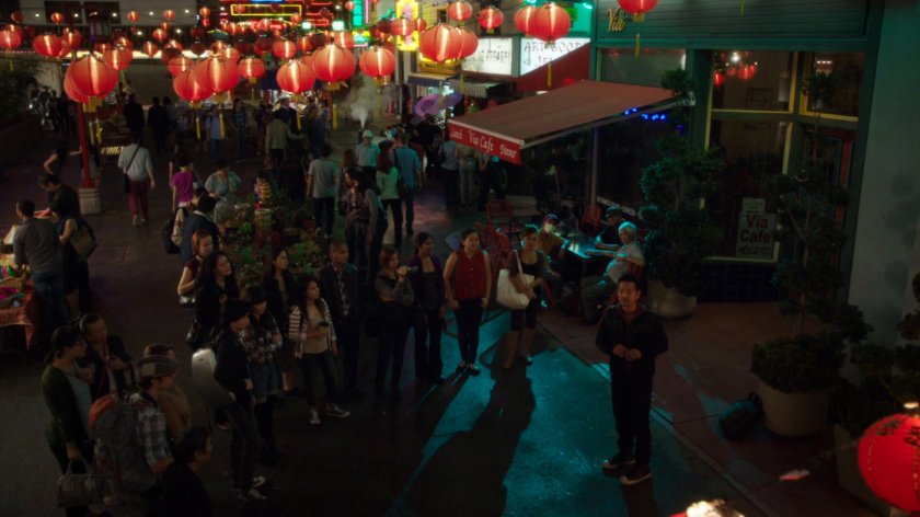 Chan Ho Yin performing street magic for crowd in Hong Kong Square.