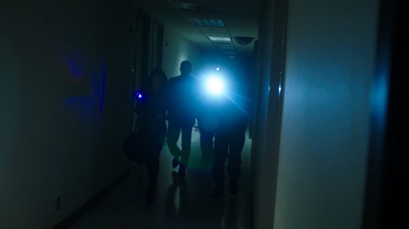 SHIELD agents in Project Centipede hallway.