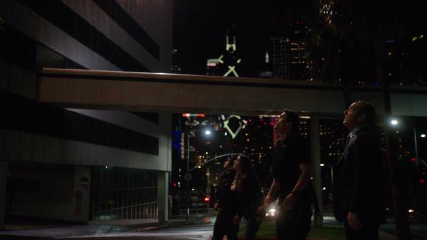 SHIELD Agents look up at Project Centipede Facility building.