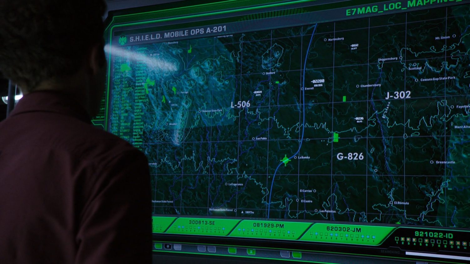 Fitz looking at a display showing a topographical map of Pennsylvania.
