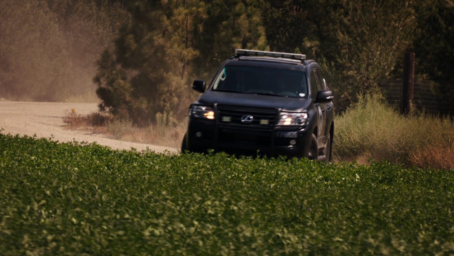 A SHIELD SUV veers off the road, and into a small field.