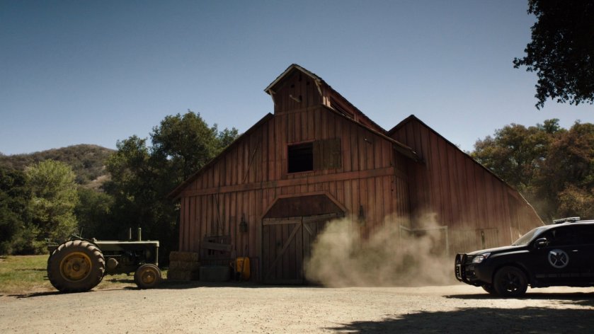 A SHIELD SUV pulls up outside an old barn in Pennsylvania.