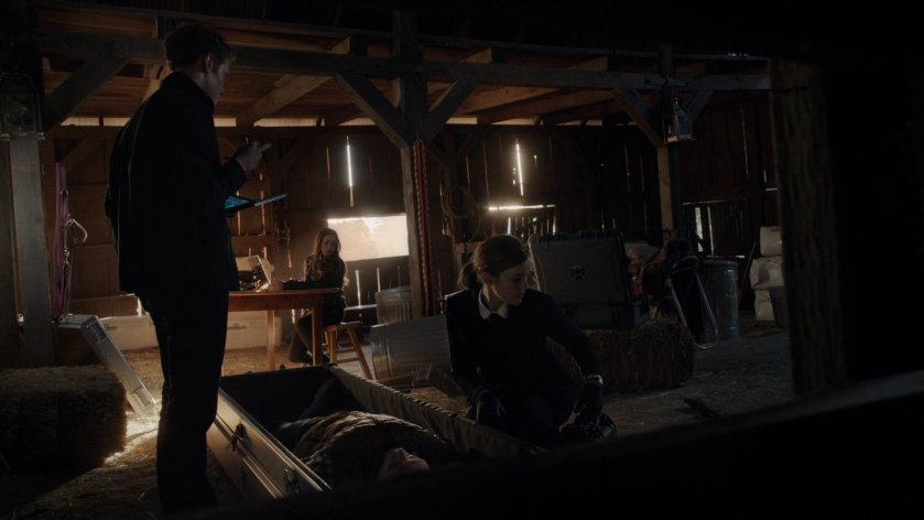 SHIELD Agents investigating inside an old barn.