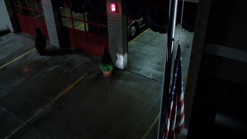 Exterior of Fire Station 77 at night.