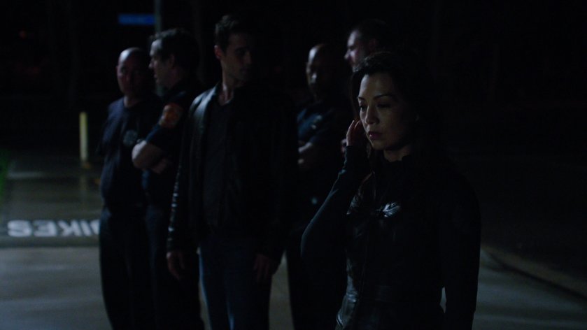 SHIELD Agents outside Station 77 at night.