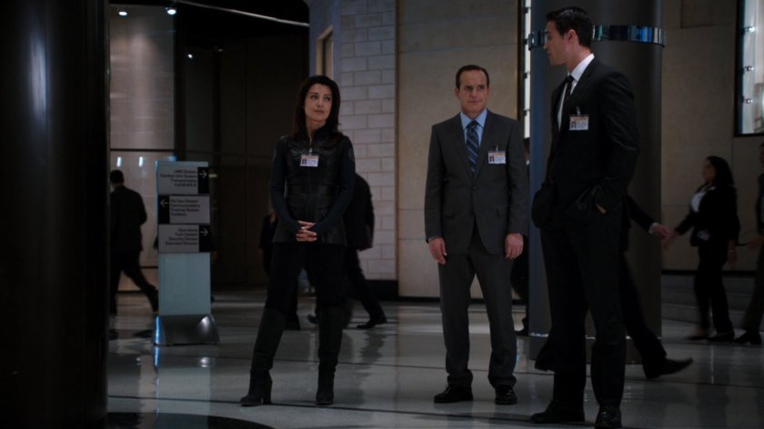 May, Coulson, and Ward in a corridor of The Hub.