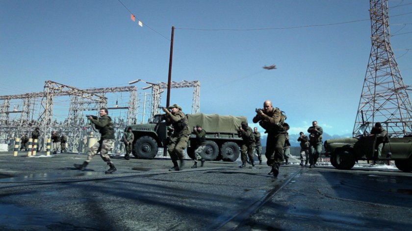 Armed men advance outside a Georgian power plant.