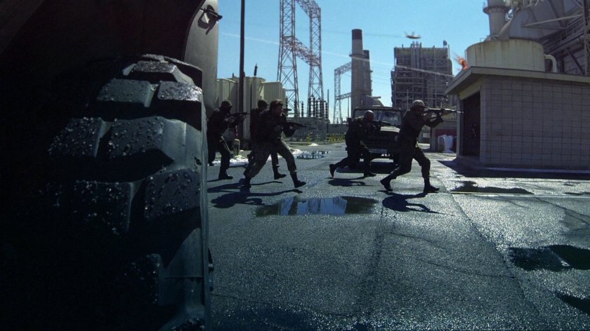 Armed men advance outside a Georgian power plant.