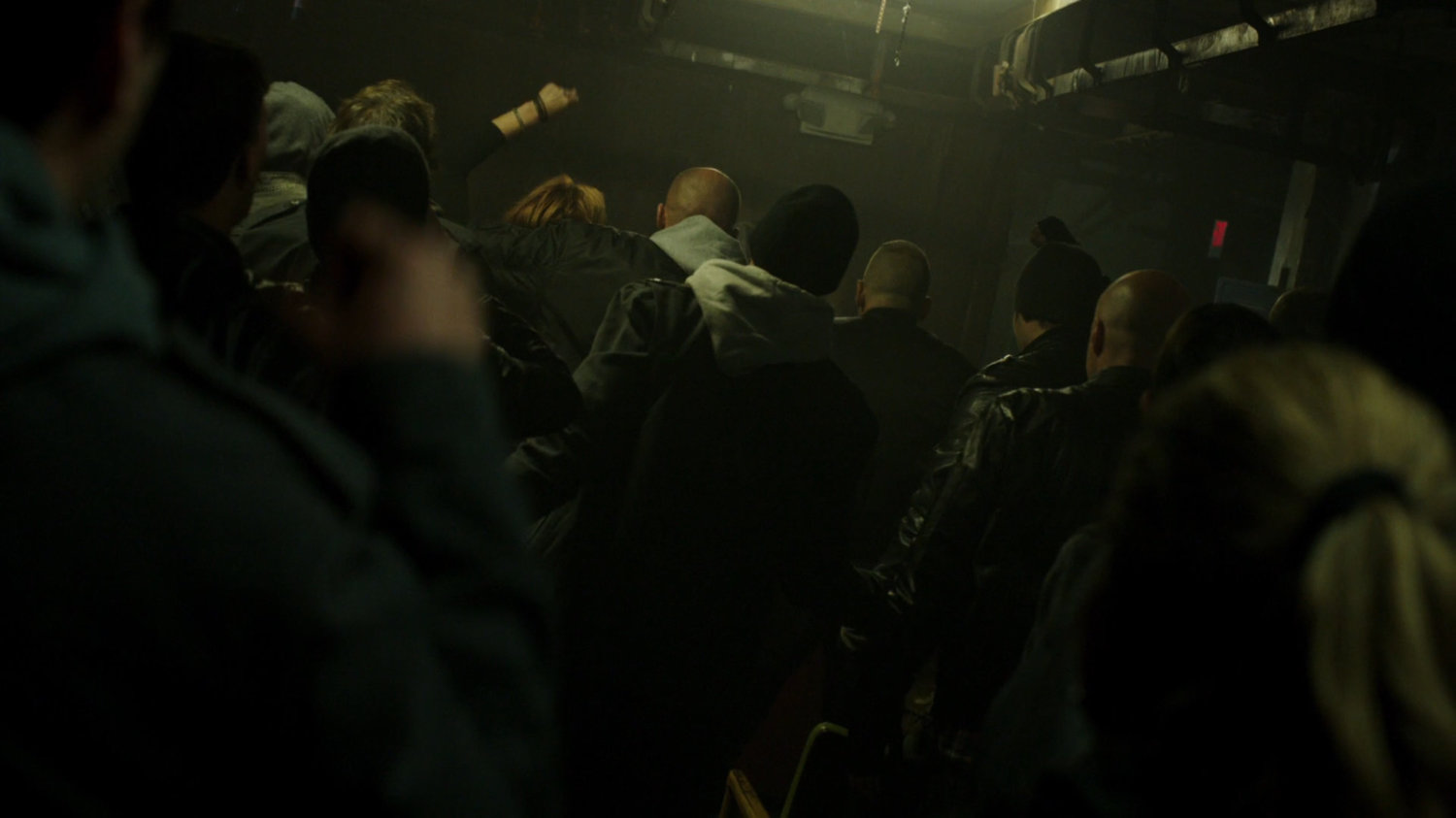 Petra and Jakob and pagans in dark underground fight club.