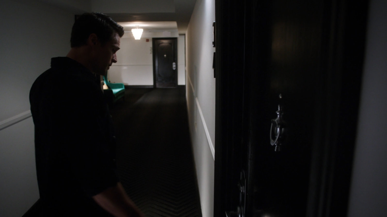 Ward in hallway of Irish Hotel.