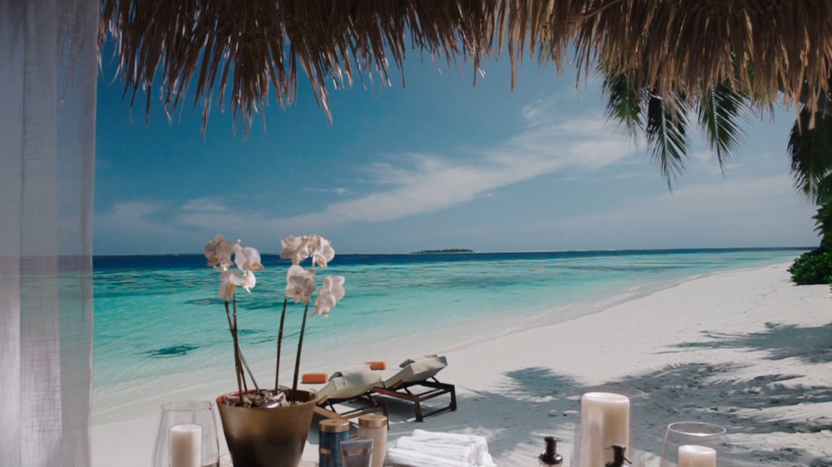 View of Tahiti beach from grass hut.