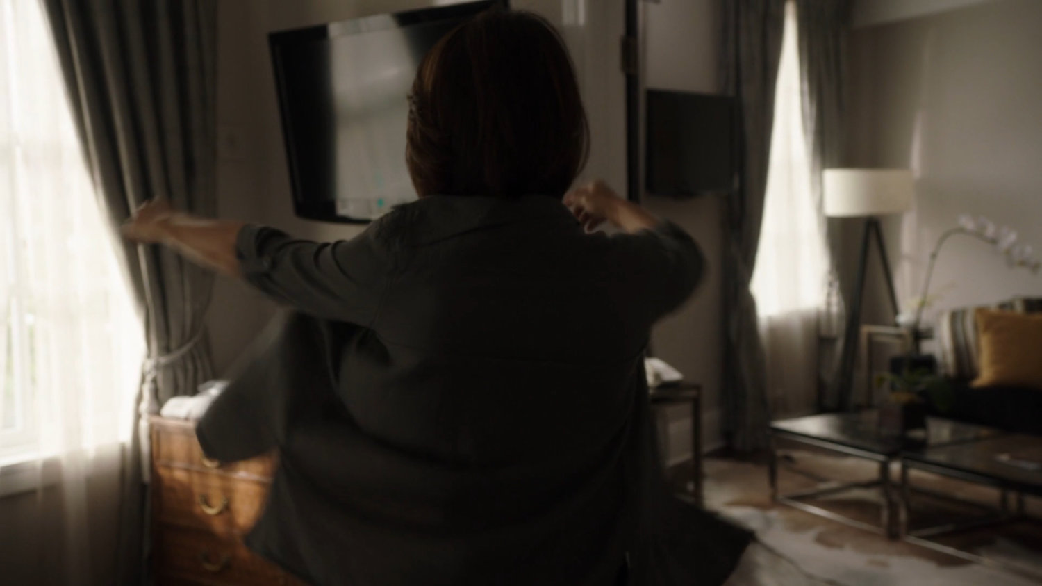 May gets dressed in a hotel room in Ireland.