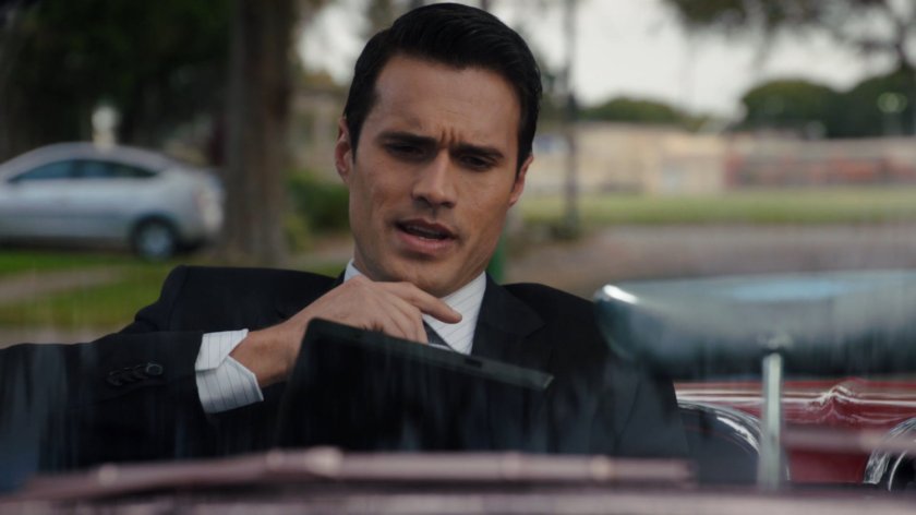 Ward looking at tablet while sitting in car.