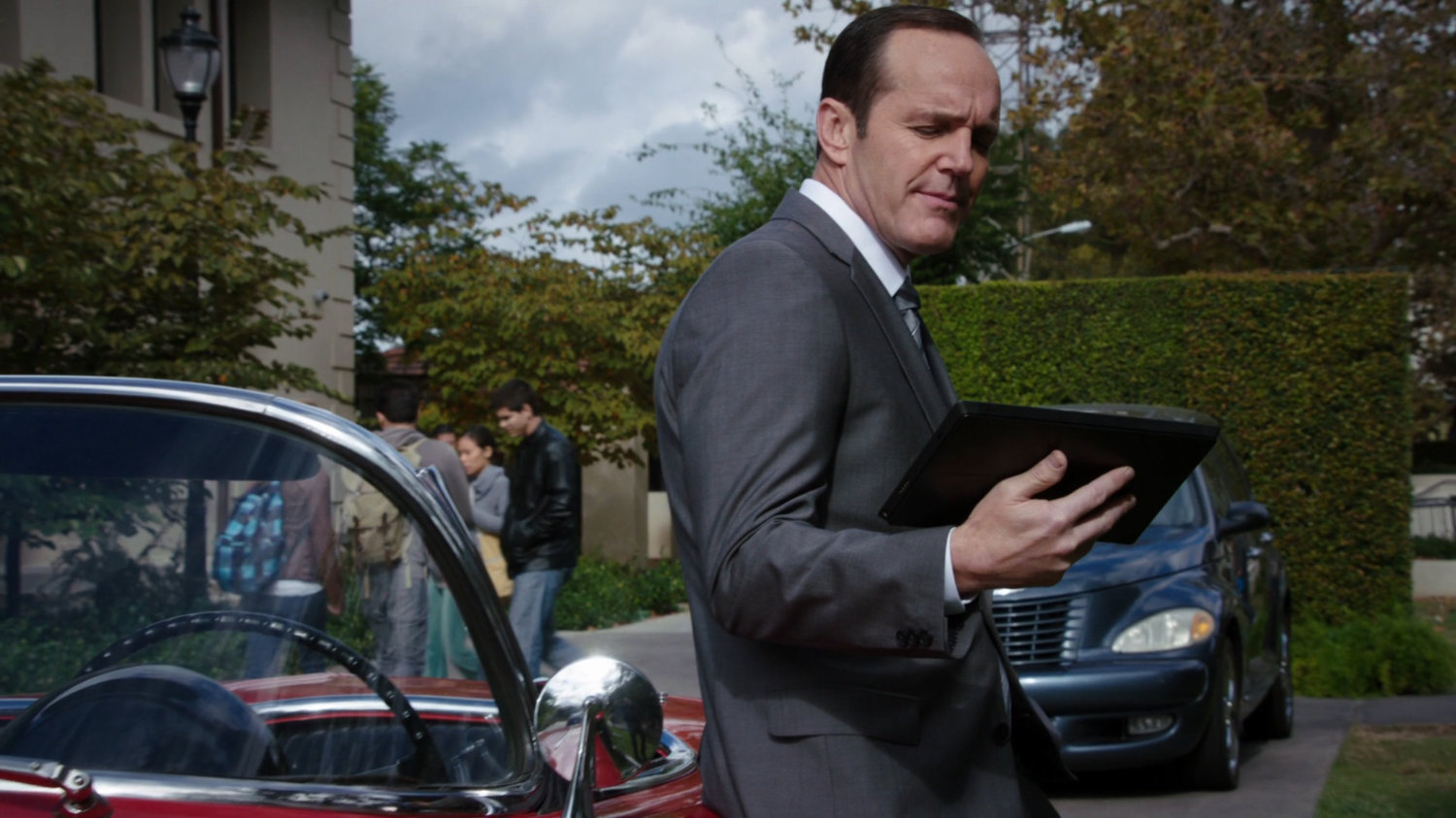Coulson leans against Lola on University of Ohio campus.