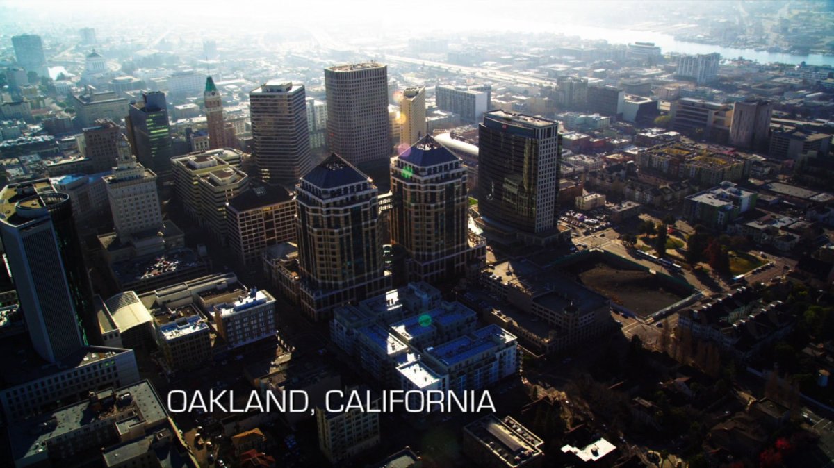 Aerial view of Oakland, California. Text: Oakland, California.