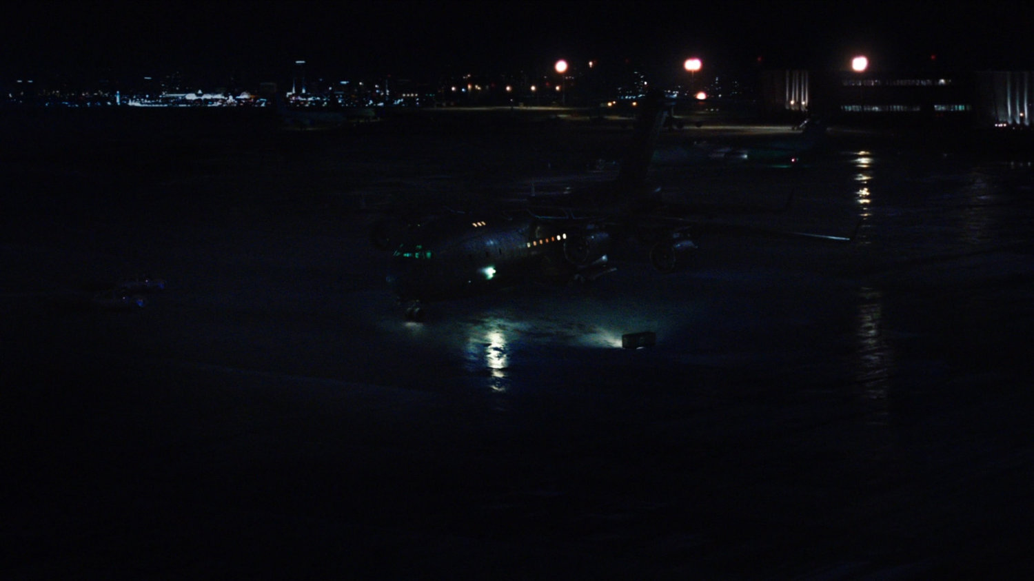 Nighttime shot of The Bus on an Oakland airfield.