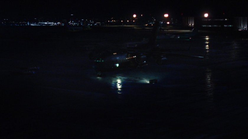 Nighttime shot of The Bus on an Oakland airfield.
