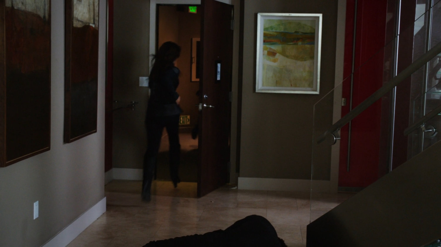 Agent May exiting suite of high rise building.