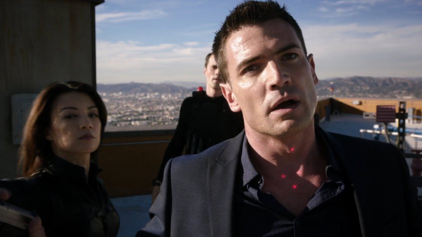 VanChat under arrest by Agents May and Ward on a high rise rooftop.