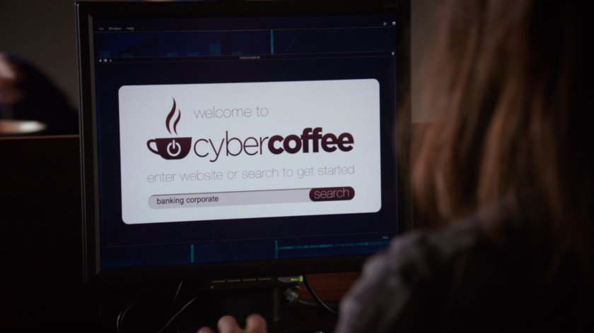 Close up of computer monitor displaying CyberCoffee logo.