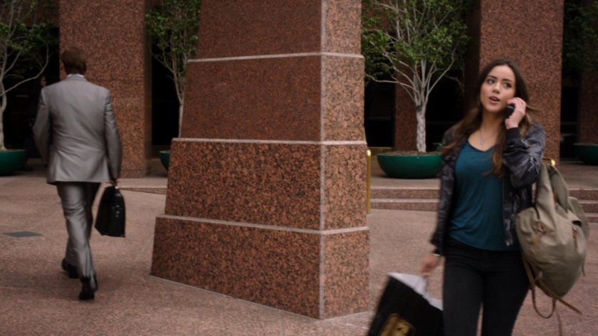 Skye on the phone in front of Lloyd Rathman's office.